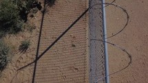 Aerial of a security fence with razor wire