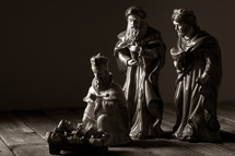 wise men and baby Jesus in a manger 