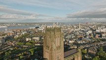 Historic Liverpool Cathedral with sprawling city and river