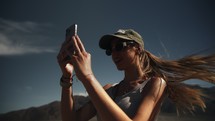 Tourist woman taking photos outdoors