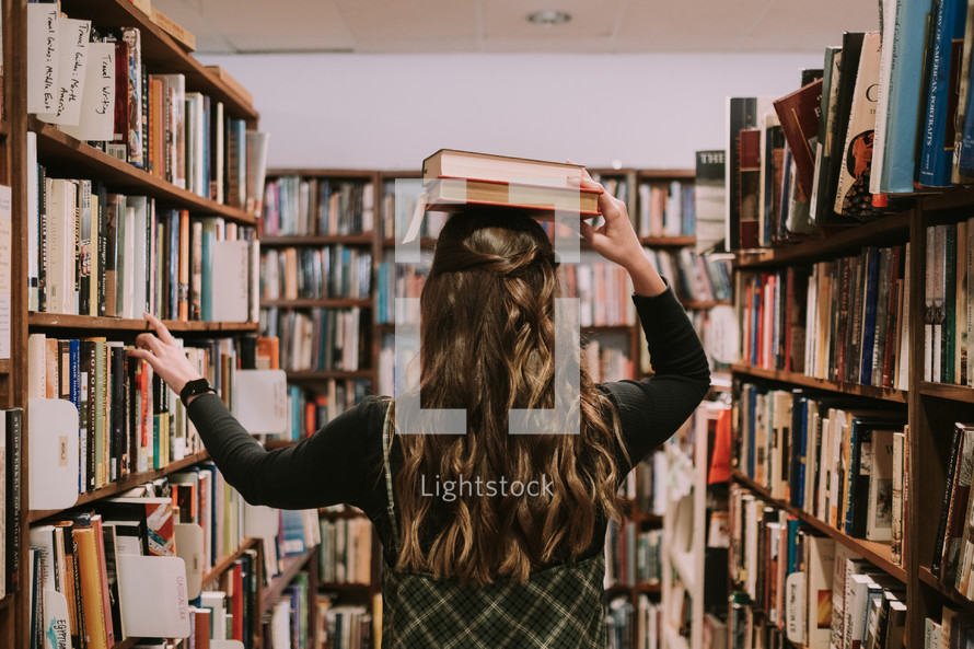 woman standing in a library 
