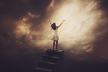a woman standing at the top of stairs to heaven 