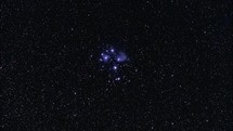 The Pleiades star cluster in the night sky