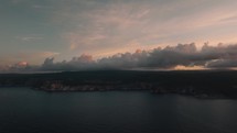 Aerial coastal view of sea cliffs and scenic clouds during sunset