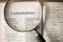 magnifying glass over Bible - Lamentations 