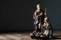 Joseph, Mary, and baby Jesus in a manger figurines 