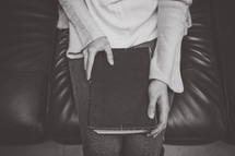 a woman with a Bible in her lap 