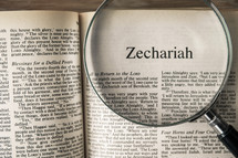 magnifying glass over Bible - Zechariah 