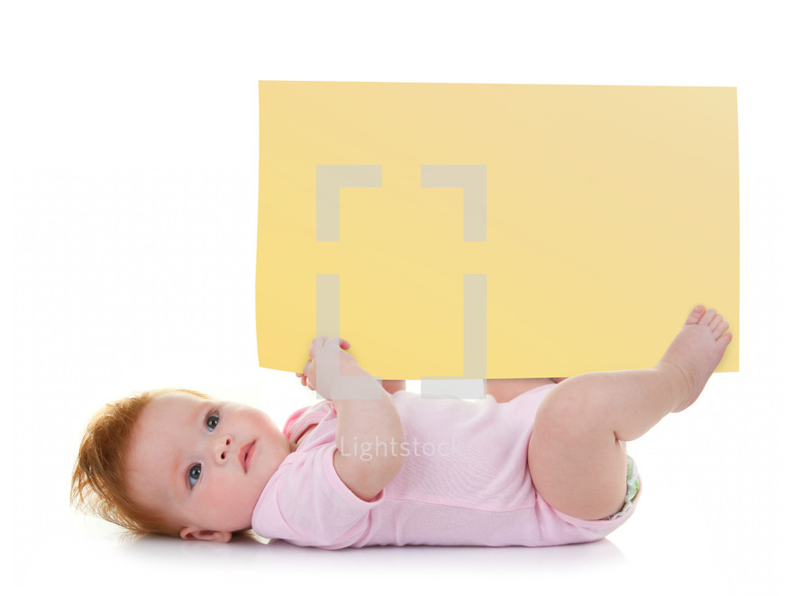 Little baby girl keeps a signpost blank to customize on white background