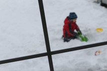 child playing in snow 