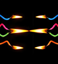 flames on burning colorful birthday candles 