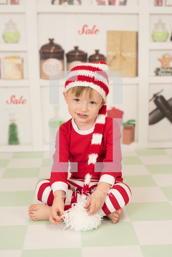 a boy in Christmas pajamas 