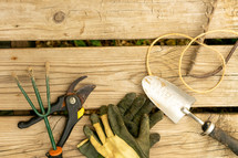 gardening tools on a wood background 