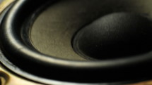 Close up of a speaker vibrating to loud music
