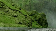 steam blowing in the breeze and mossy shoreline in Iceland 