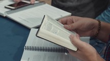 reading Bibles at a Bible study 