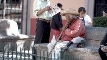 a man resting on a bench in Mexico 