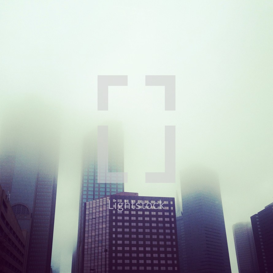 Downtown Dallas skyscraper building in fog.