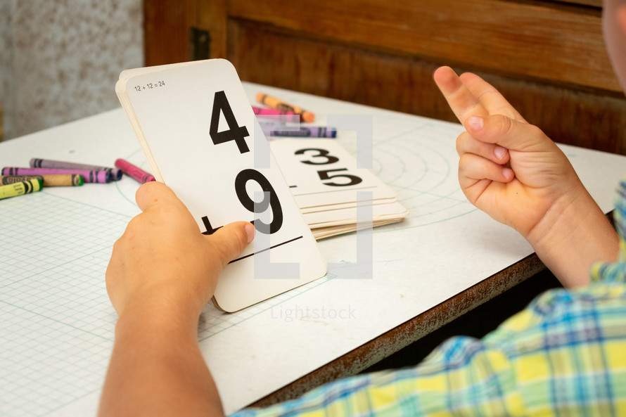 a child learning math with math flashcards 