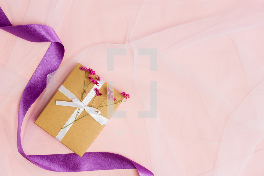 wrapped gift and purple ribbon 