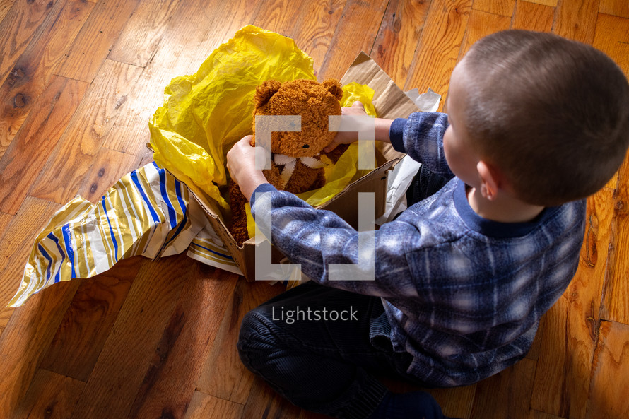 child opening a gift 