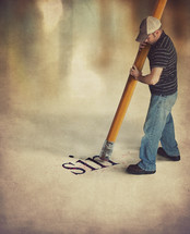 man holding a giant pencil erasing the word sin