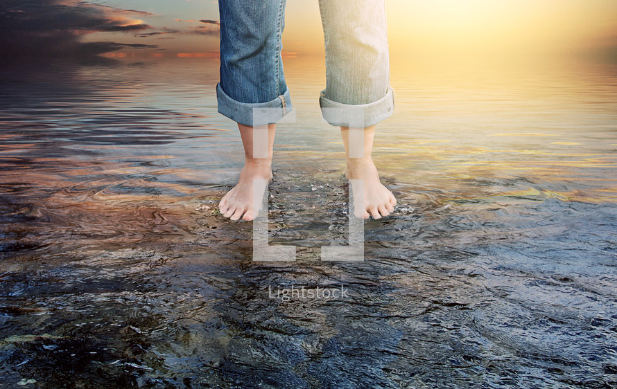 bare feet standing in water 