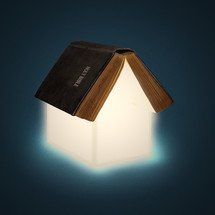 A house of light coming from a Bible 