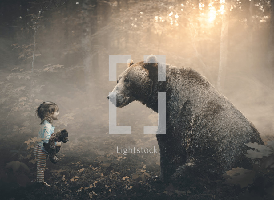 a little girl with a bear in a forest 