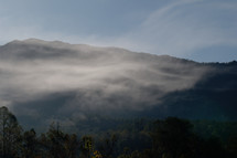 dense fog over a mountain landscape 