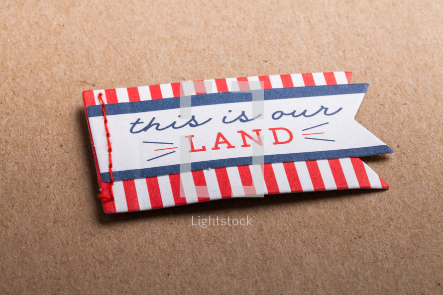 This is our land felt badge 