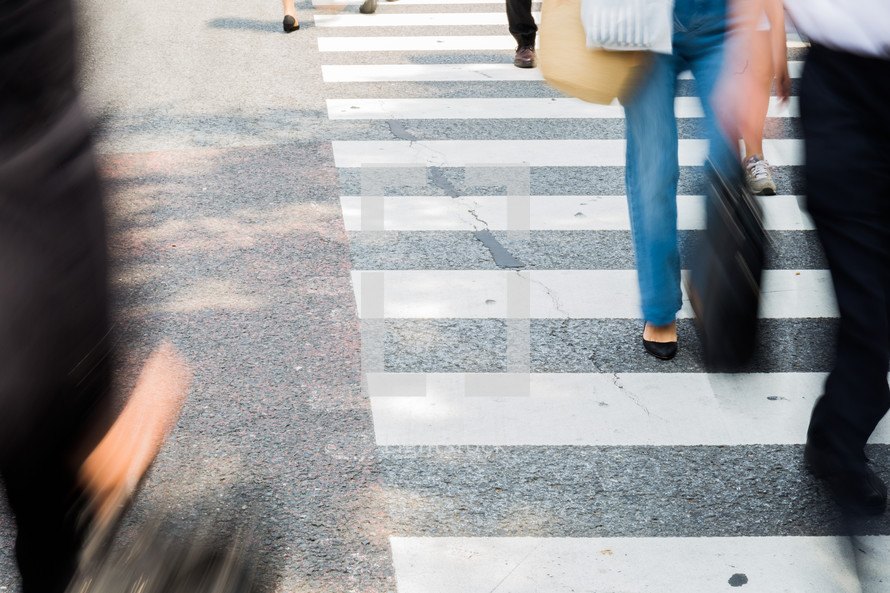 people crossing a crosswalk 