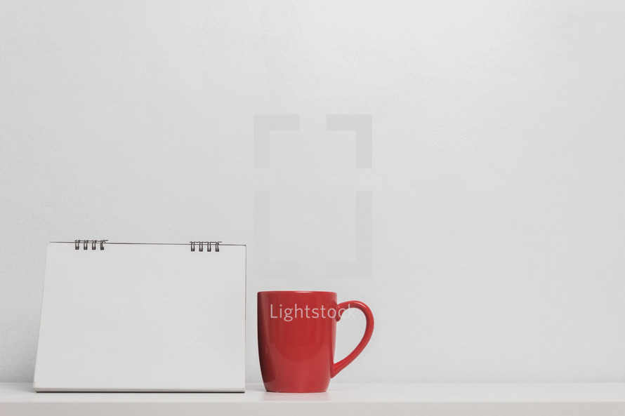 blank paper and red mug 