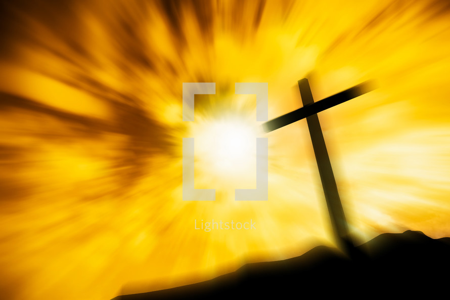 glowing radiating yellow light and cross silhouette 