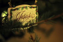 Christmas ornament with the word Jesus.