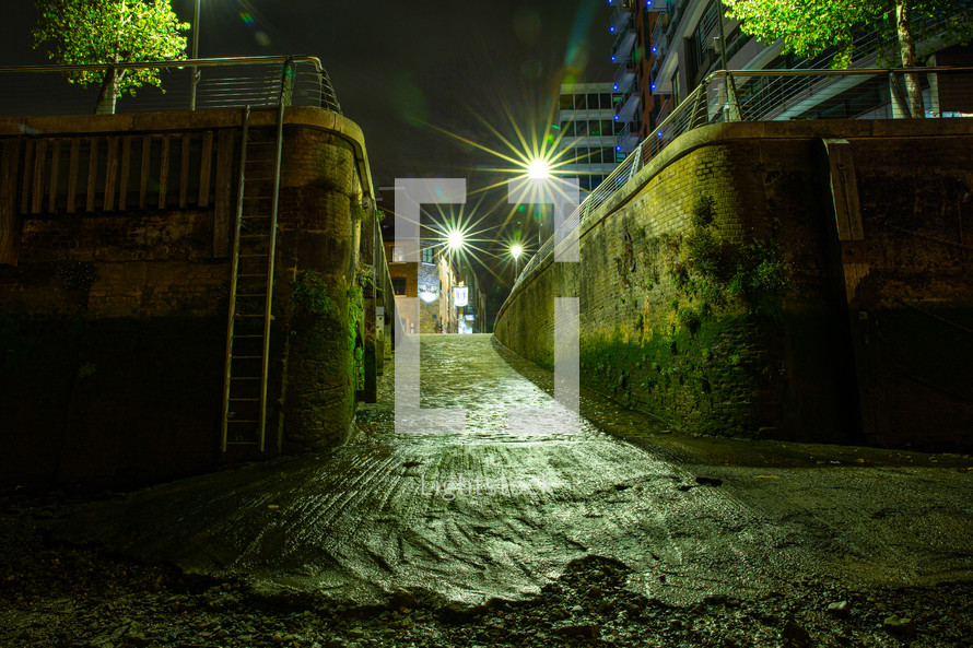 alley in a city at night 