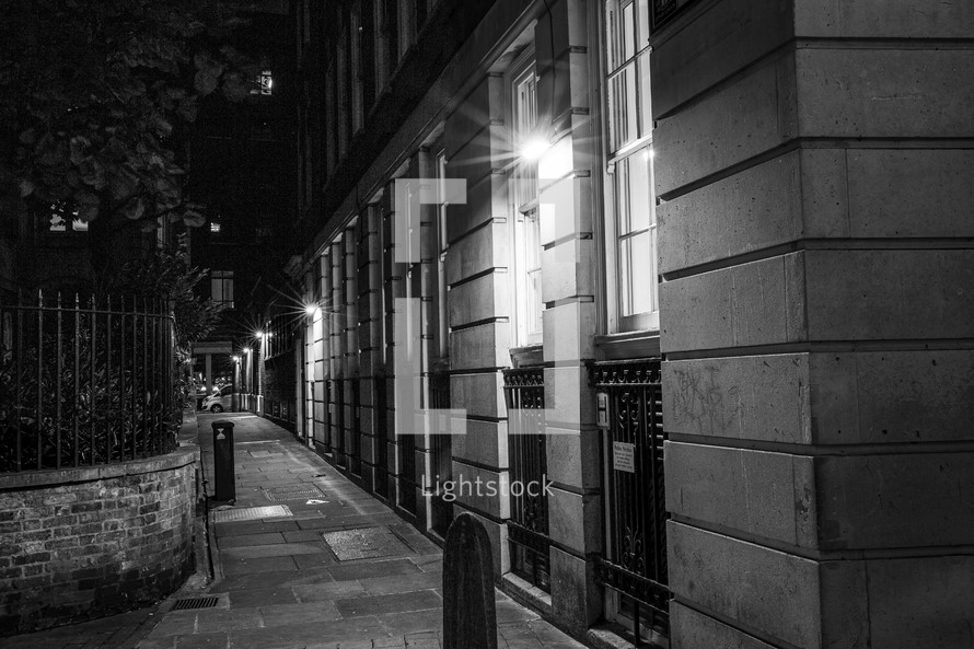 downtown city sidewalk at night 