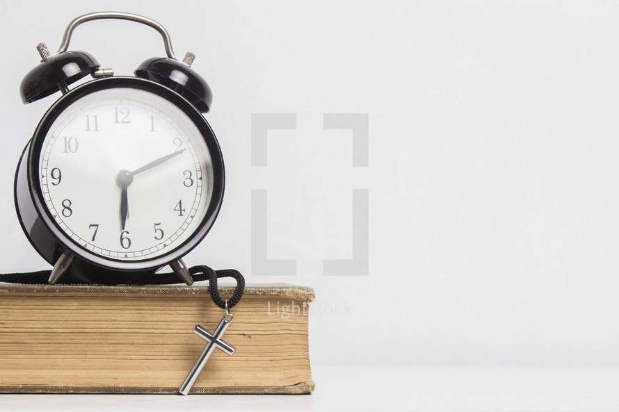 alarm clock on a Bible 