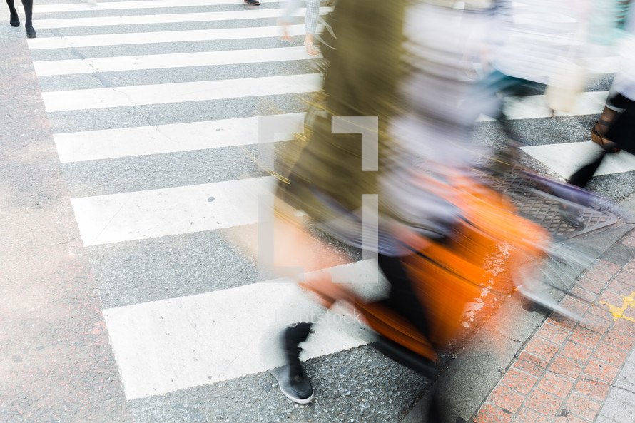 people crossing a crosswalk 