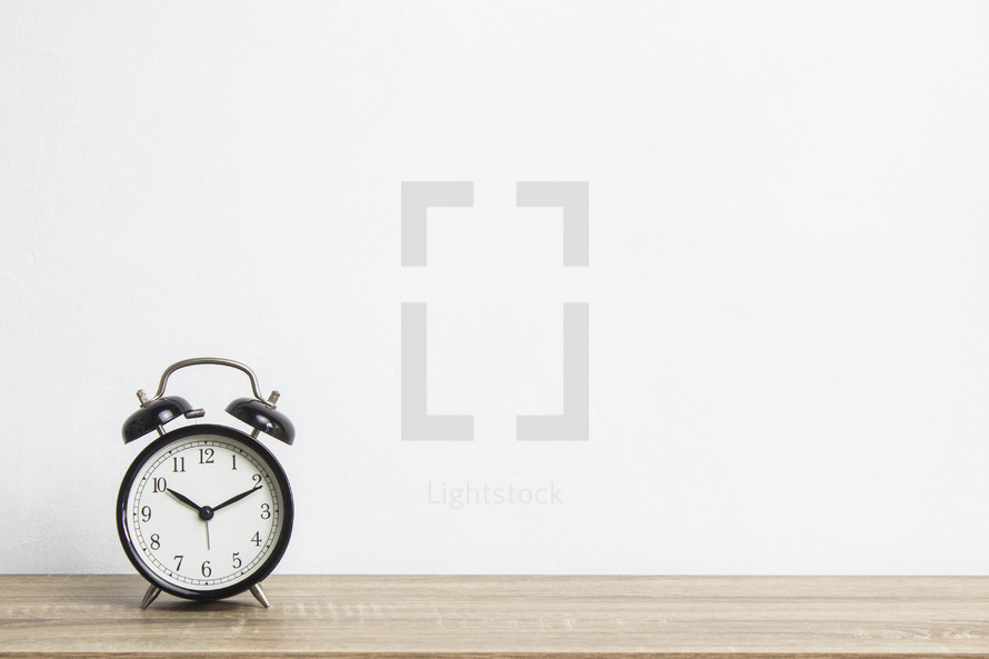 alarm clock and a white background 