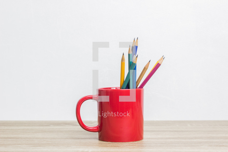 pencils in a red mug 