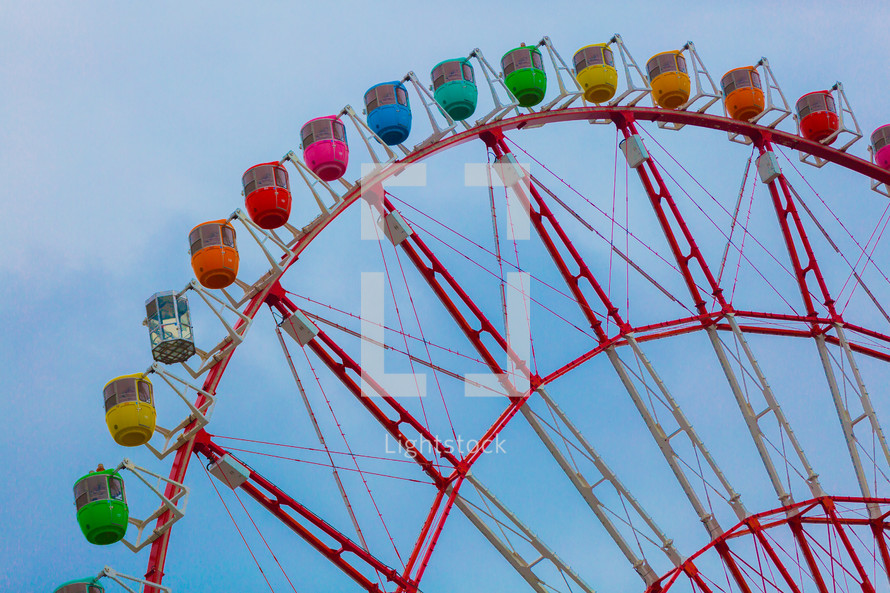 colorful seats on a ferris wheel 