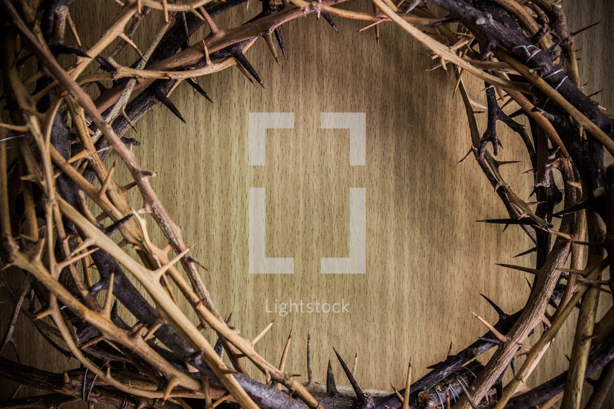 crown of thorns over a wood background 