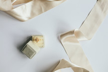 a ring in a box and ribbon