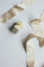 a ring in a box and ribbon 