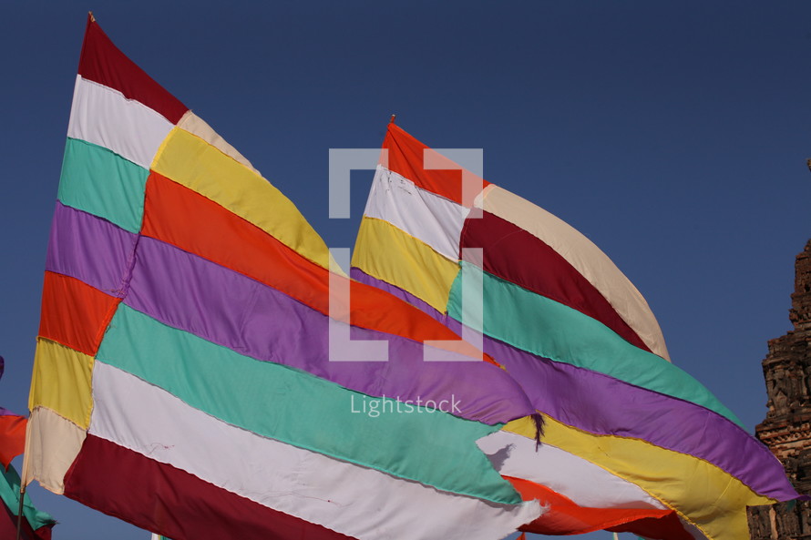 colorful flags against a blue sky 