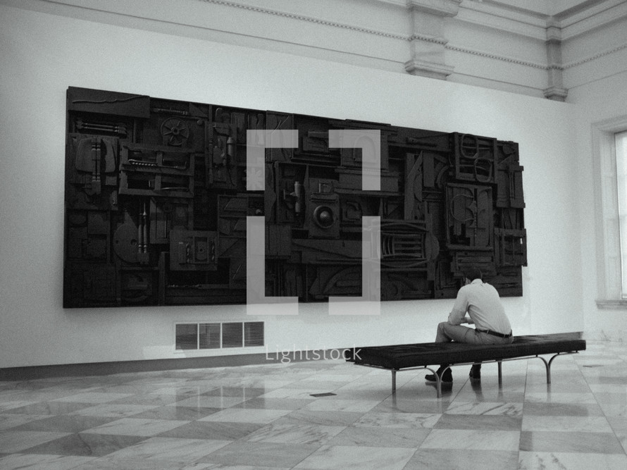 man enjoying art in a museum 