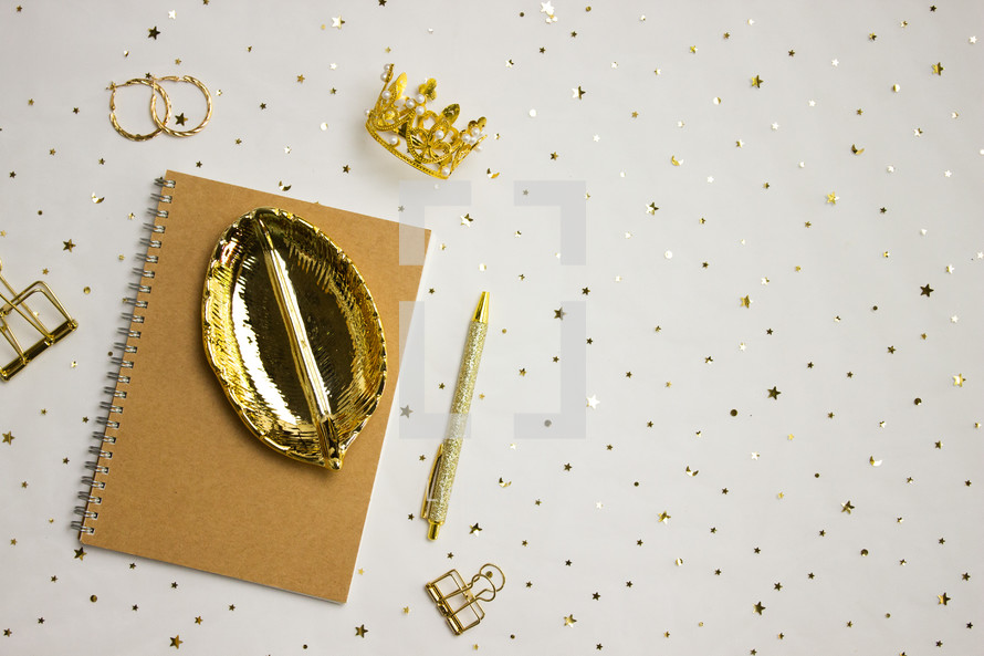 Gold office supplies and holder with gold confetti