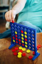 child playing connect four 
