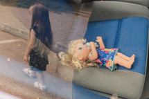 a doll in a carseat 
